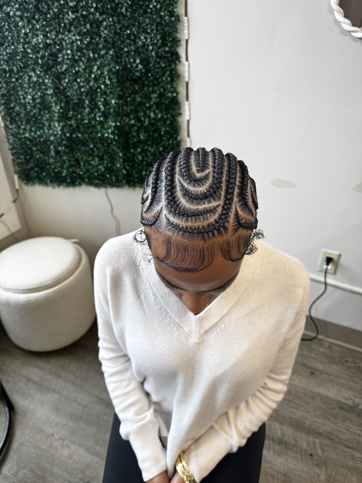 Intricate cornrow braiding pattern showcasing precise parting and clean lines