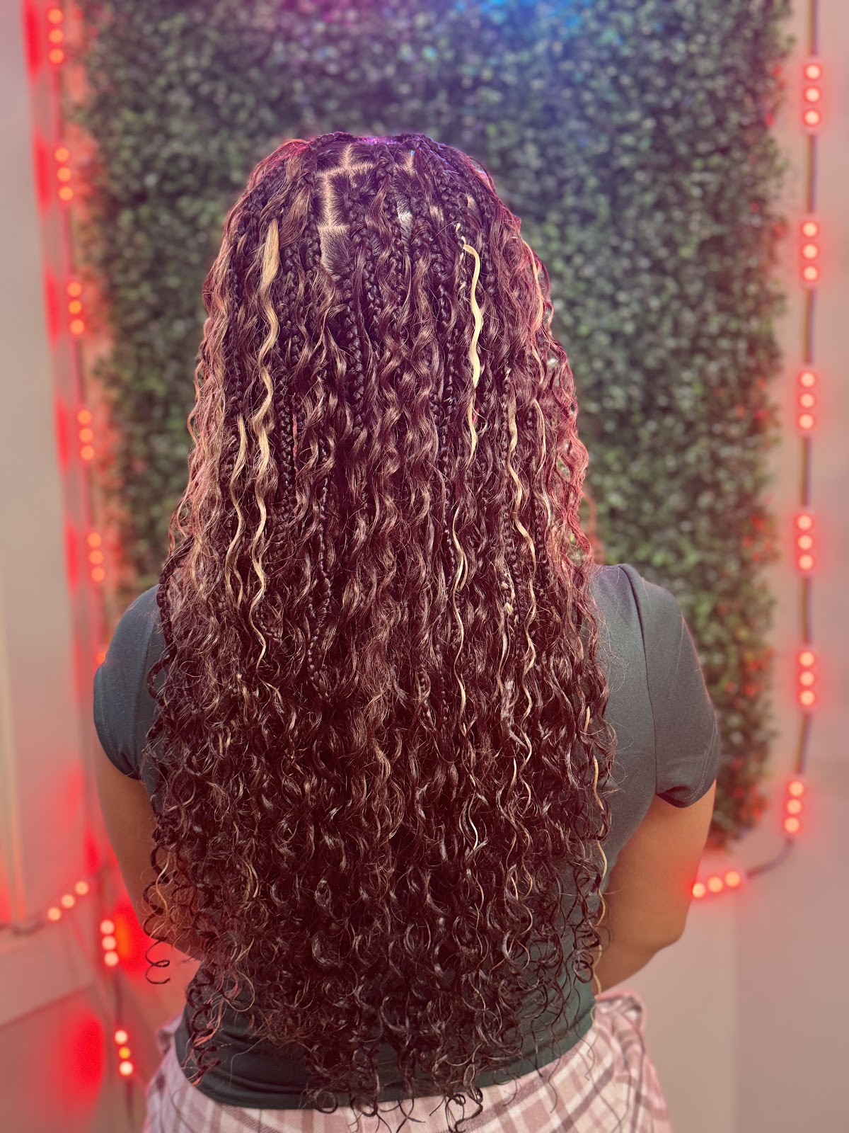 Long goddess braids with wavy extensions in burgundy and blonde highlights